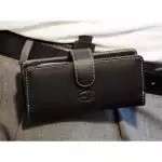 CasYy Universalköcher mit Rotationsclip für DECT Telefone, vertikal, Leder, schwarz